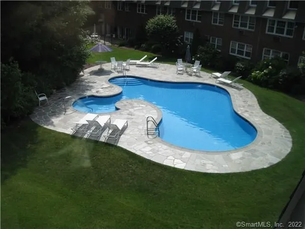 a view of swimming pool from a garden