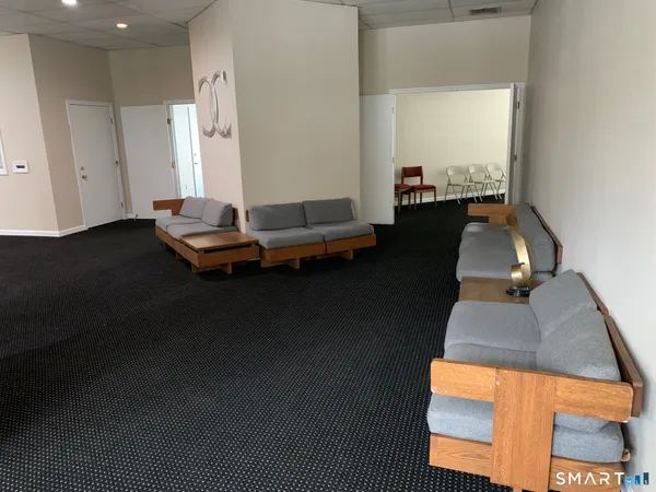 a room with water heater and wooden floor