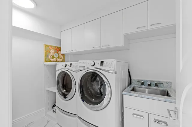 a view of a lake with houses in the back