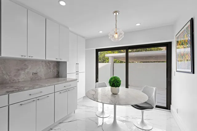 a kitchen with stainless steel appliances a refrigerator and a sink