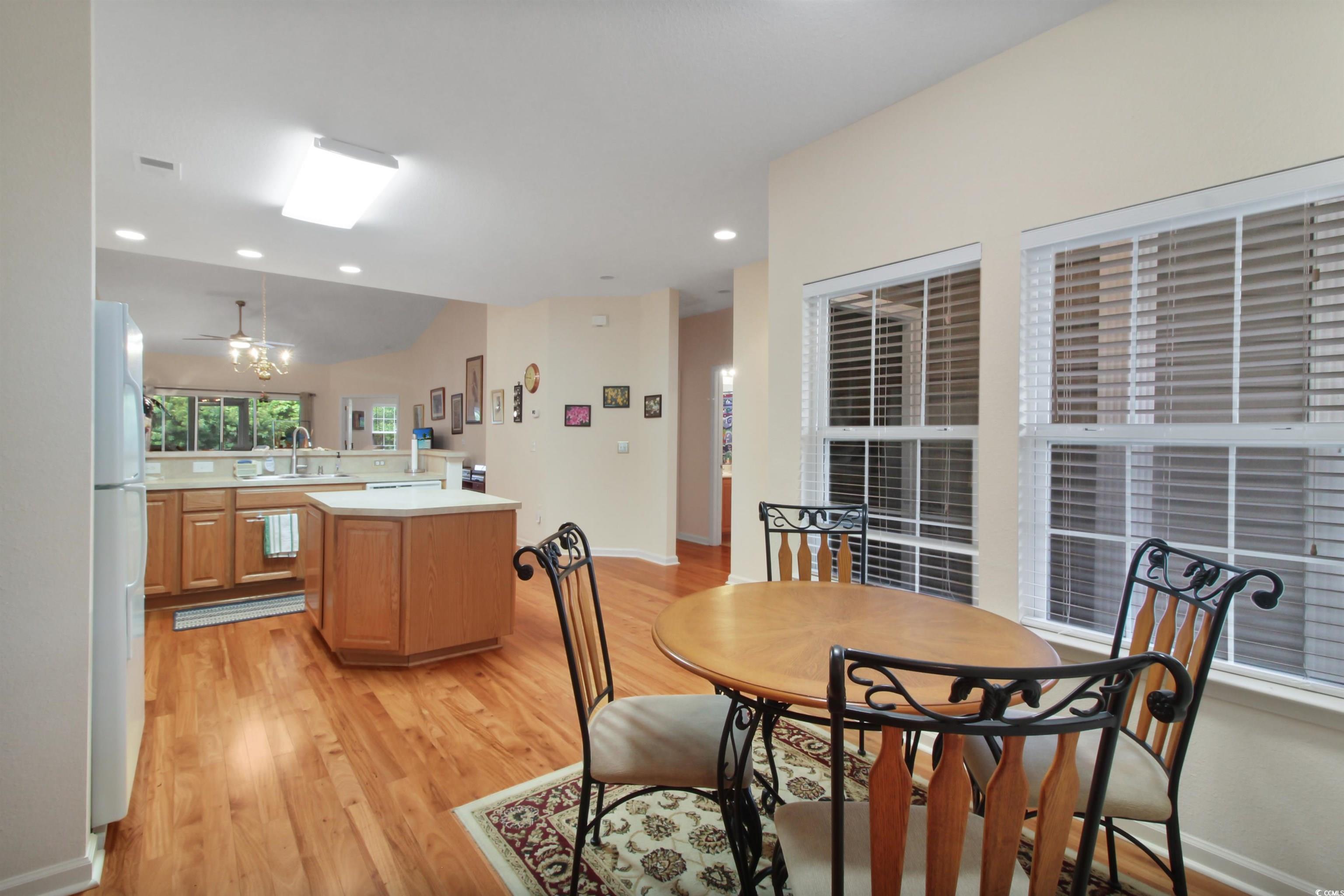301 Nut Hatch Lane, Unit D Murrells Inlet, SC 29576 - Photo 10 of 40 Dining area featuring light wood-type flooring, recessed lighting, and a chandelier