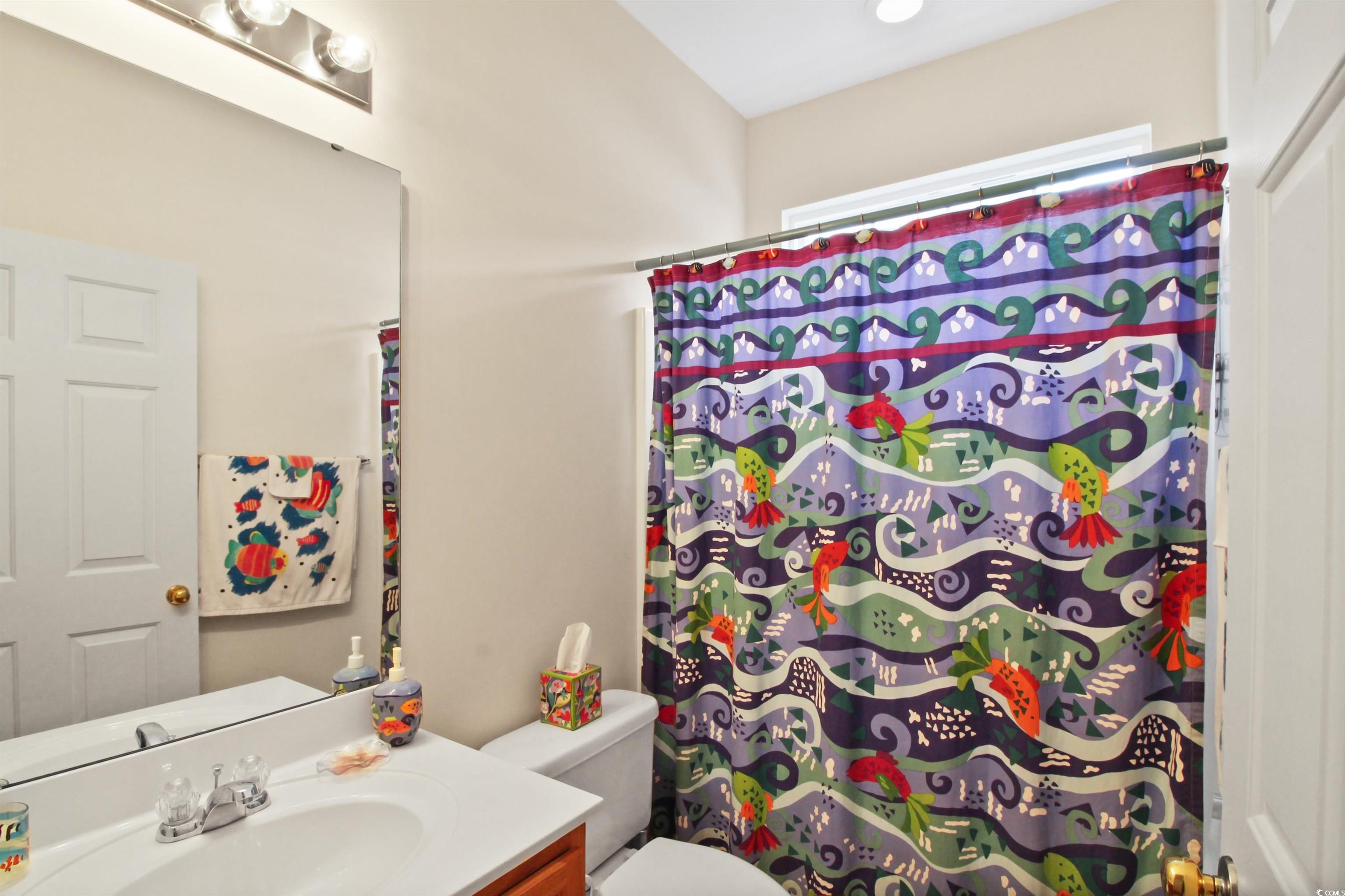 301 Nut Hatch Lane, Unit D Murrells Inlet, SC 29576 - Photo 11 of 40 Bathroom featuring vanity and a shower with shower curtain