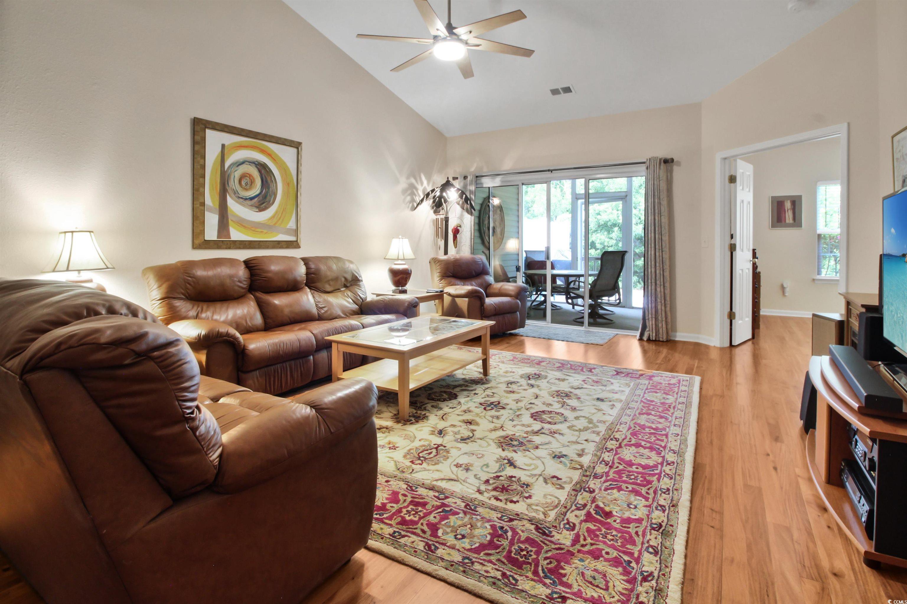 301 Nut Hatch Lane, Unit D Murrells Inlet, SC 29576 - Photo 27 of 40 Living room with light wood-type flooring, vaulted ceiling, an office area, and ceiling fan