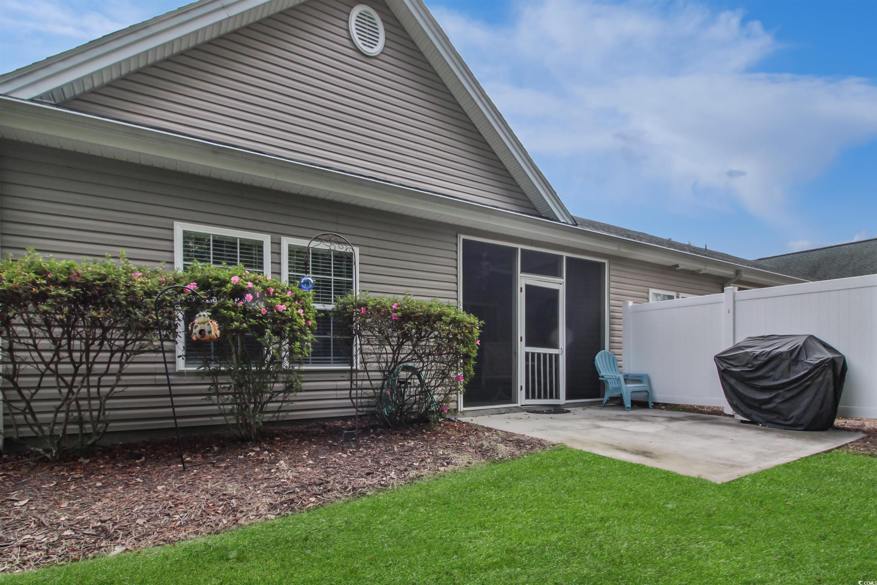 301 Nut Hatch Lane, Unit D Murrells Inlet, SC 29576 - Photo 29 of 40 Back of house with a sunroom and a patio