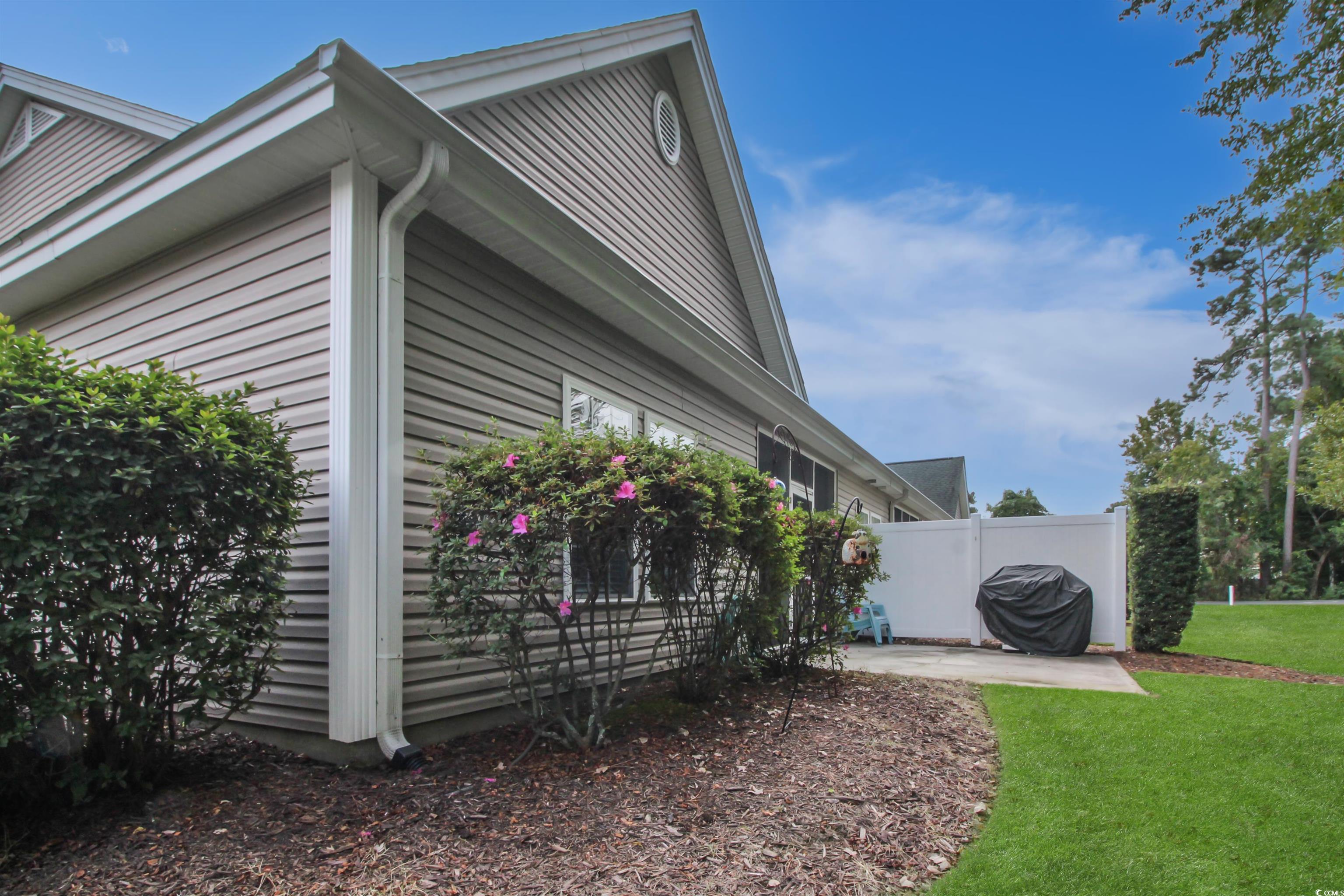 301 Nut Hatch Lane, Unit D Murrells Inlet, SC 29576 - Photo 30 of 40 View of property exterior with a patio