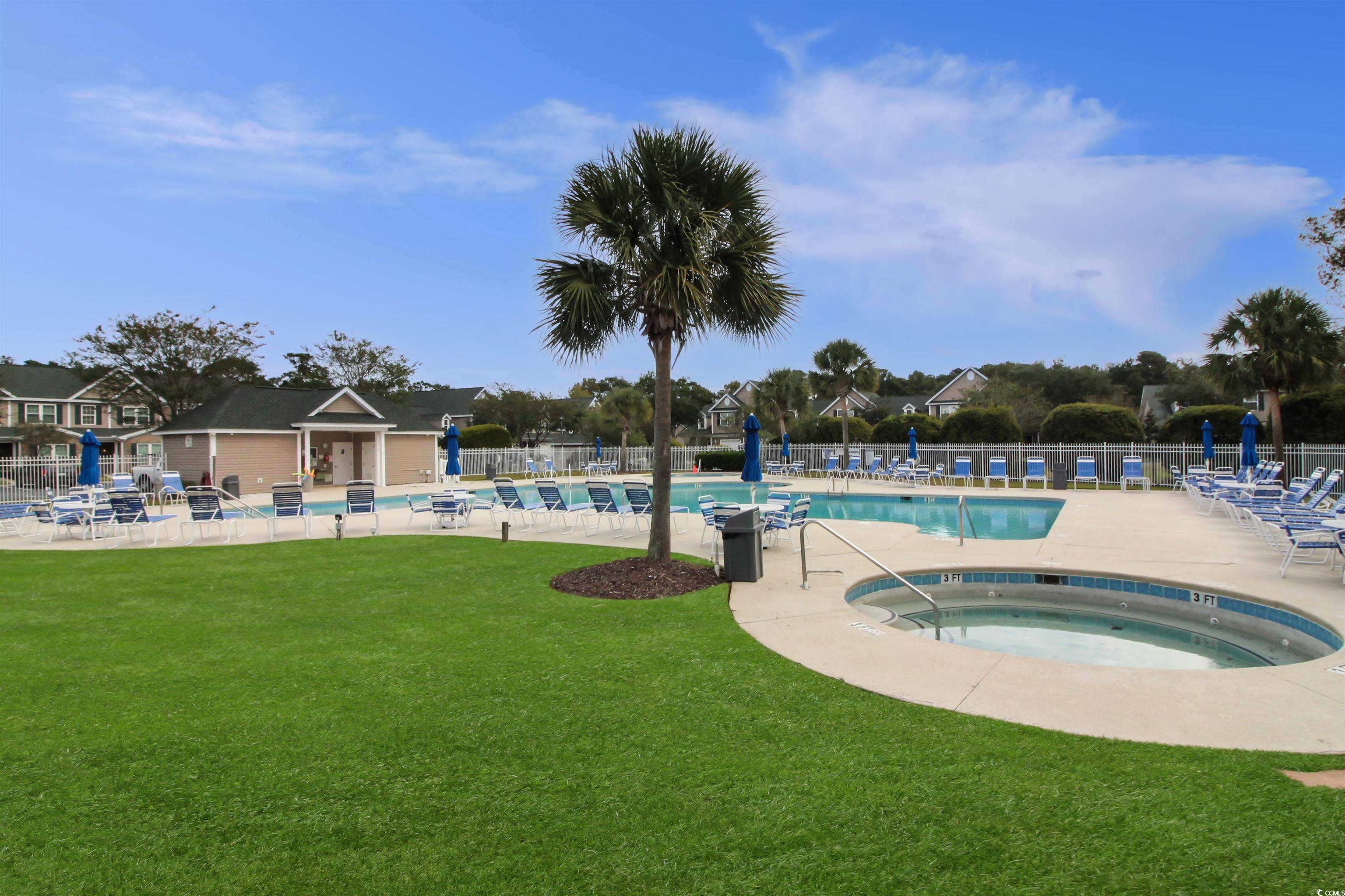 301 Nut Hatch Lane, Unit D Murrells Inlet, SC 29576 - Photo 36 of 40 Community pool featuring a community hot tub and a patio area