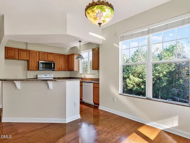 a view of kitchen with furniture and a window