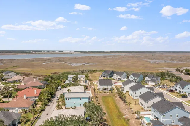 a front view of a house with a garden and yard