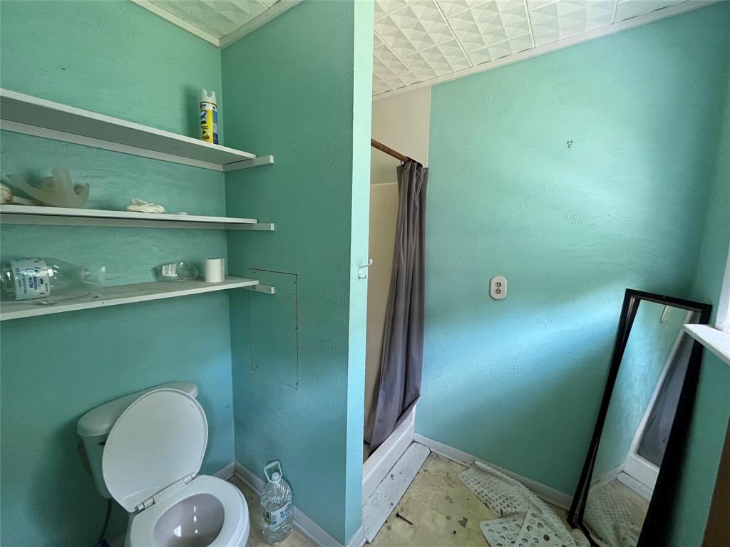 437 Redbud A Groesbeck, TX 76642 - Photo 12 of 18 a bathroom with a toilet and a sink