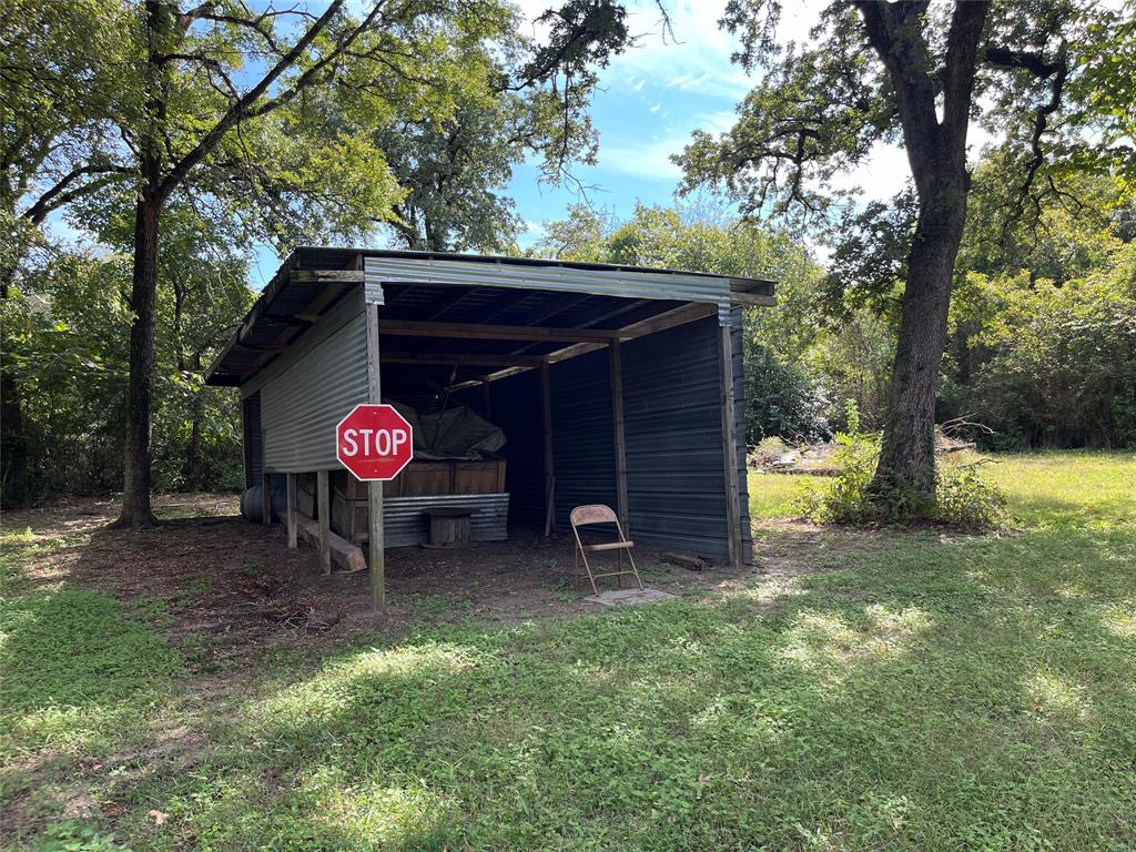 437 Redbud A Groesbeck, TX 76642 - Photo 16 of 18 a table and chairs under a tree