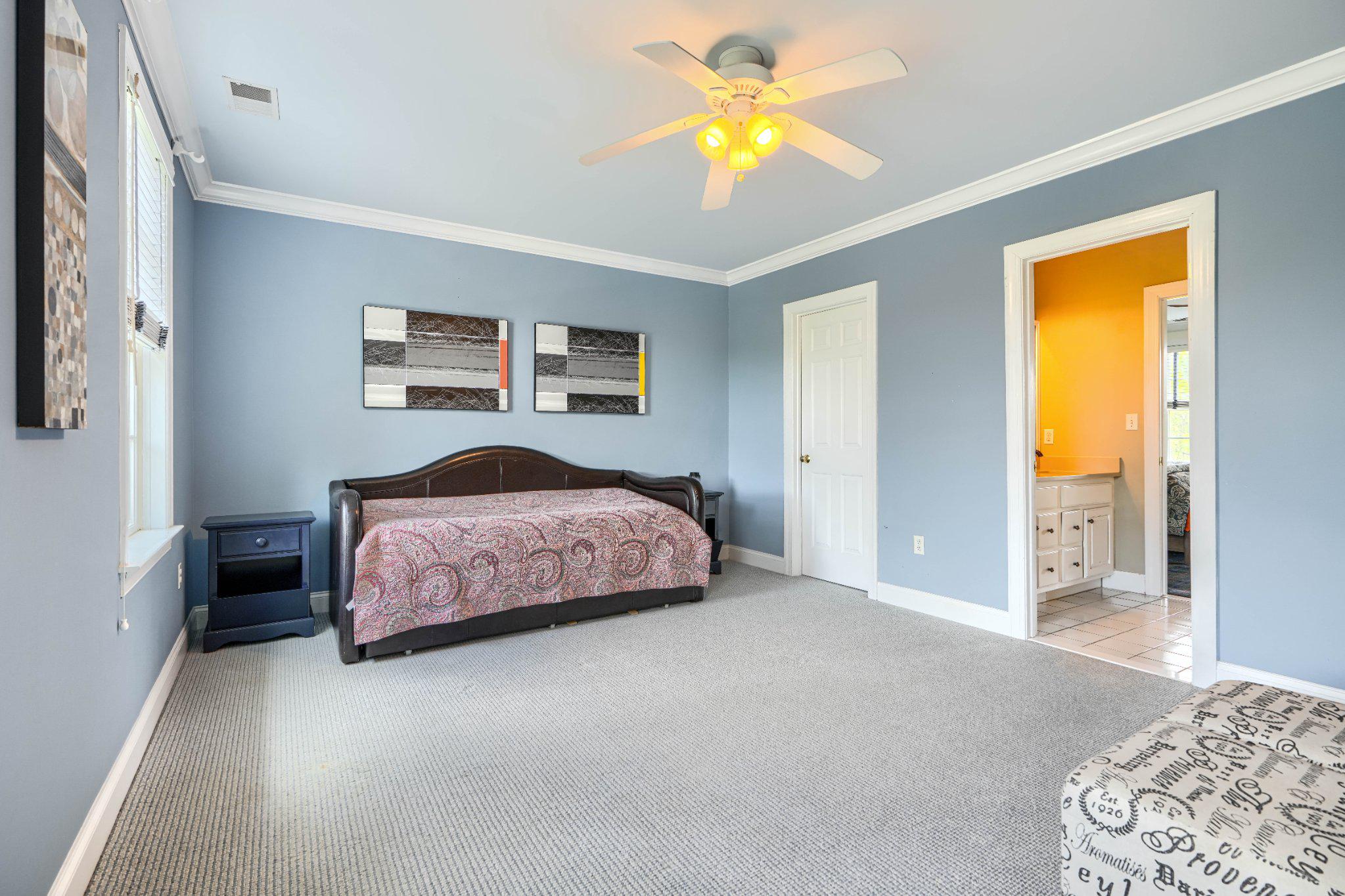 2415 Old Bosley Road Lutherville-Timonium, MD 21093 - Photo 37 of 65 a bedroom with a bed and a chandelier
