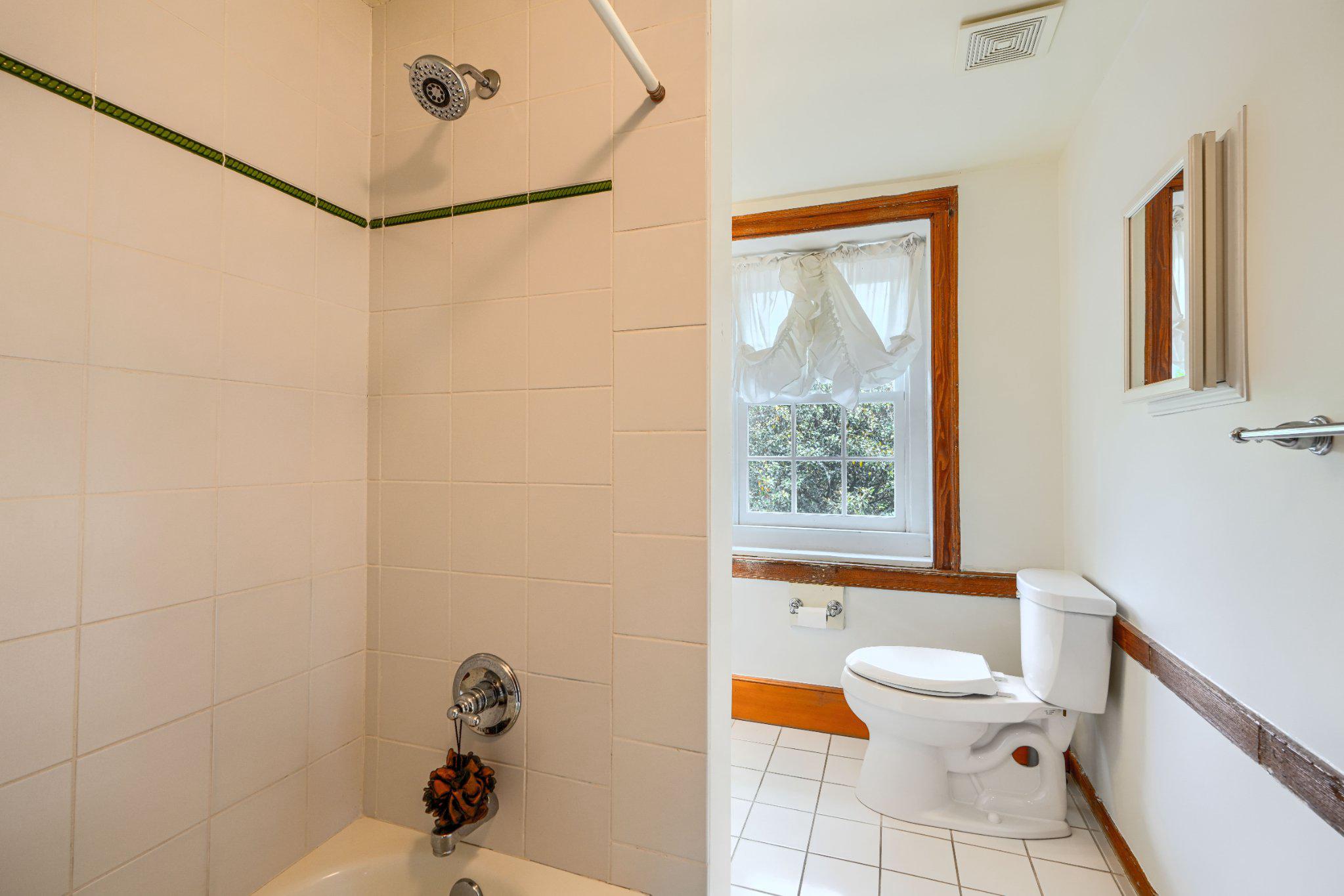 2415 Old Bosley Road Lutherville-Timonium, MD 21093 - Photo 43 of 65 a white toilet sitting next to a bathroom sink