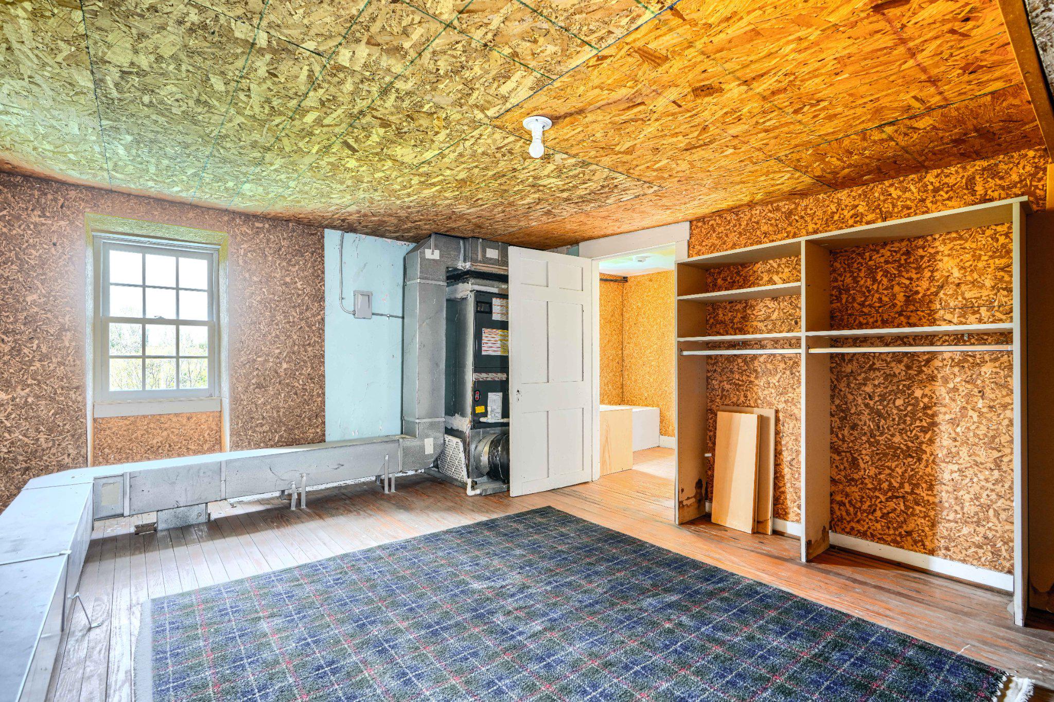 2415 Old Bosley Road Lutherville-Timonium, MD 21093 - Photo 46 of 65 a view of a bedroom with wooden floor and a sink