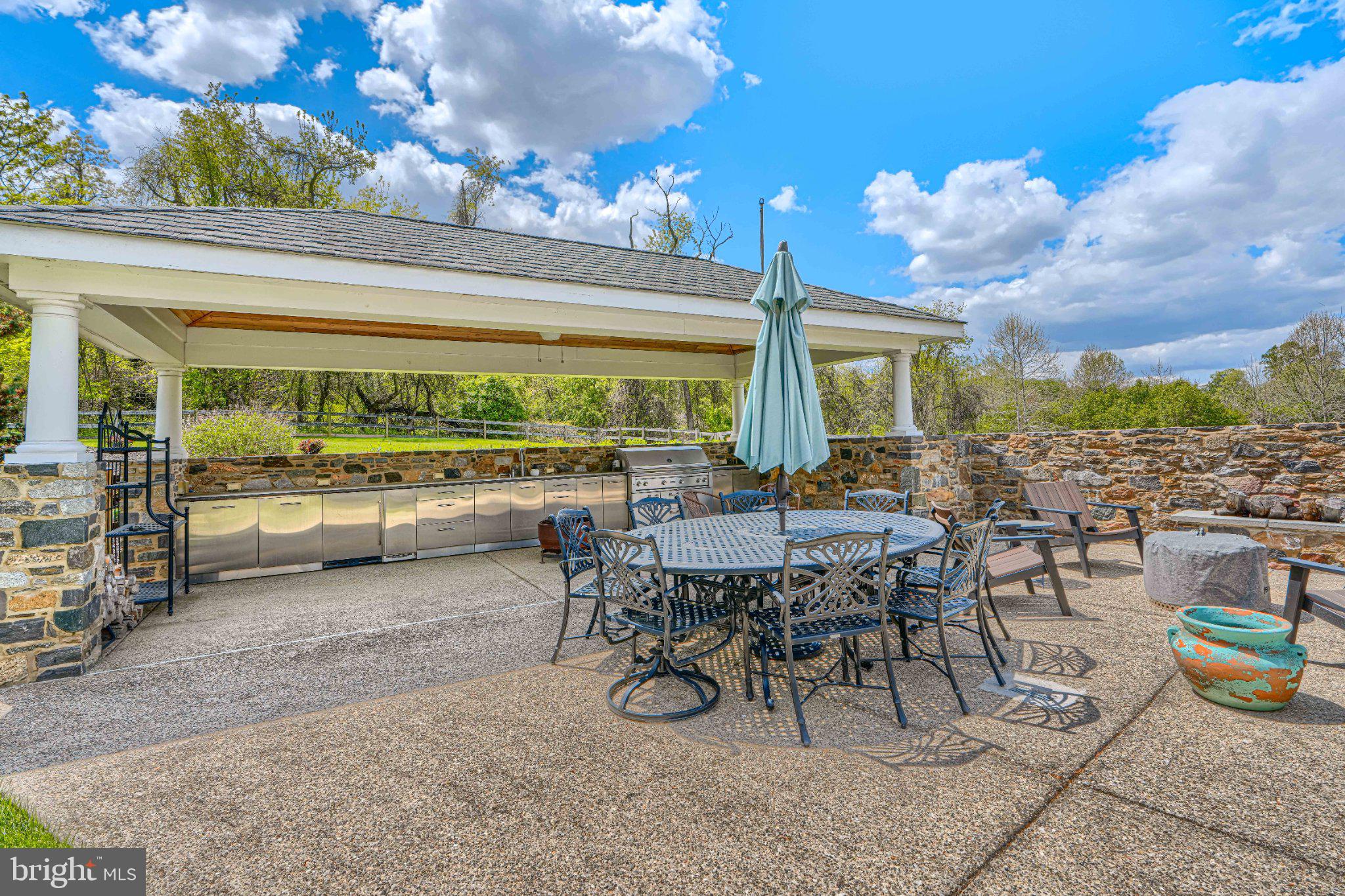2415 Old Bosley Road Lutherville-Timonium, MD 21093 - Photo 56 of 65 a view of a patio with table and chairs and potted plants