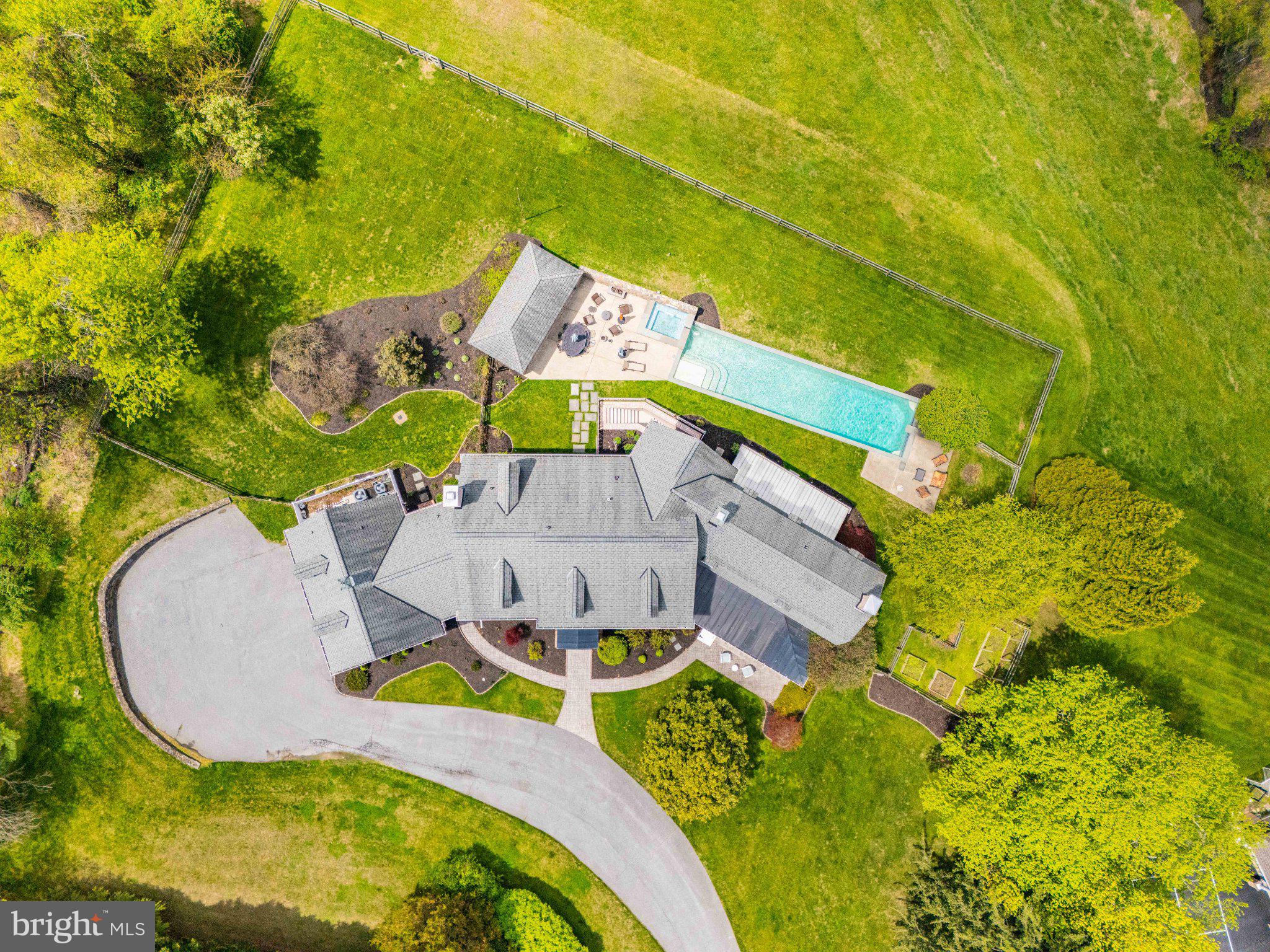 2415 Old Bosley Road Lutherville-Timonium, MD 21093 - Photo 63 of 65 an aerial view of a house with swimming pool and large trees