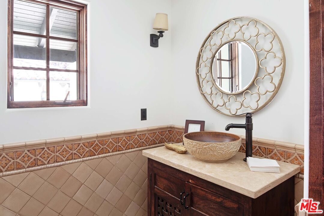 2251 Cold Canyon Road Calabasas, CA 91302 - Photo 22 of 47 a bathroom with a sink and a mirror