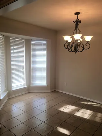 a view of a room with a large window