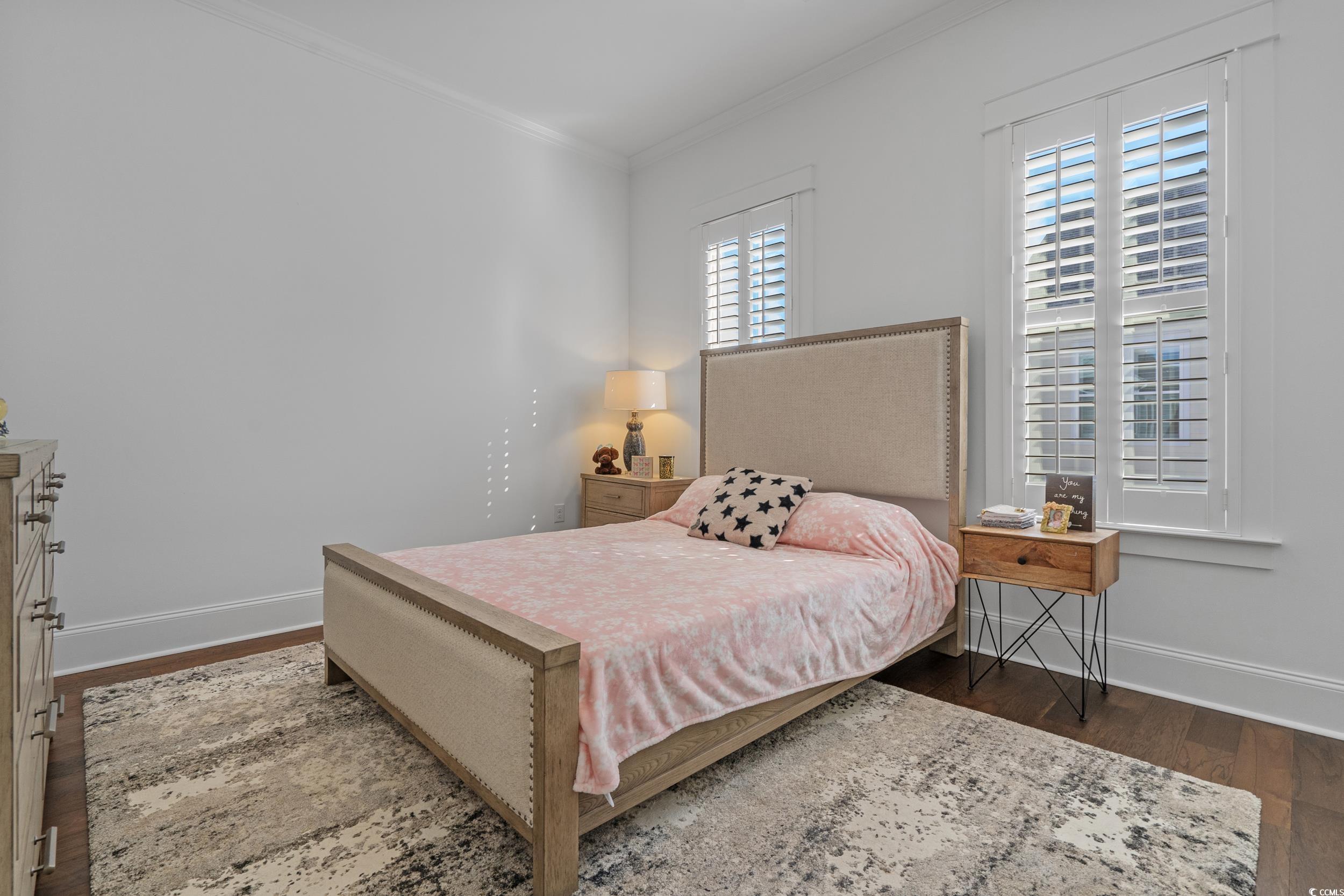 927 Iris Street Myrtle Beach, SC 29577 - Photo 30 of 40 Bedroom featuring dark wood-style floors and ornamental molding