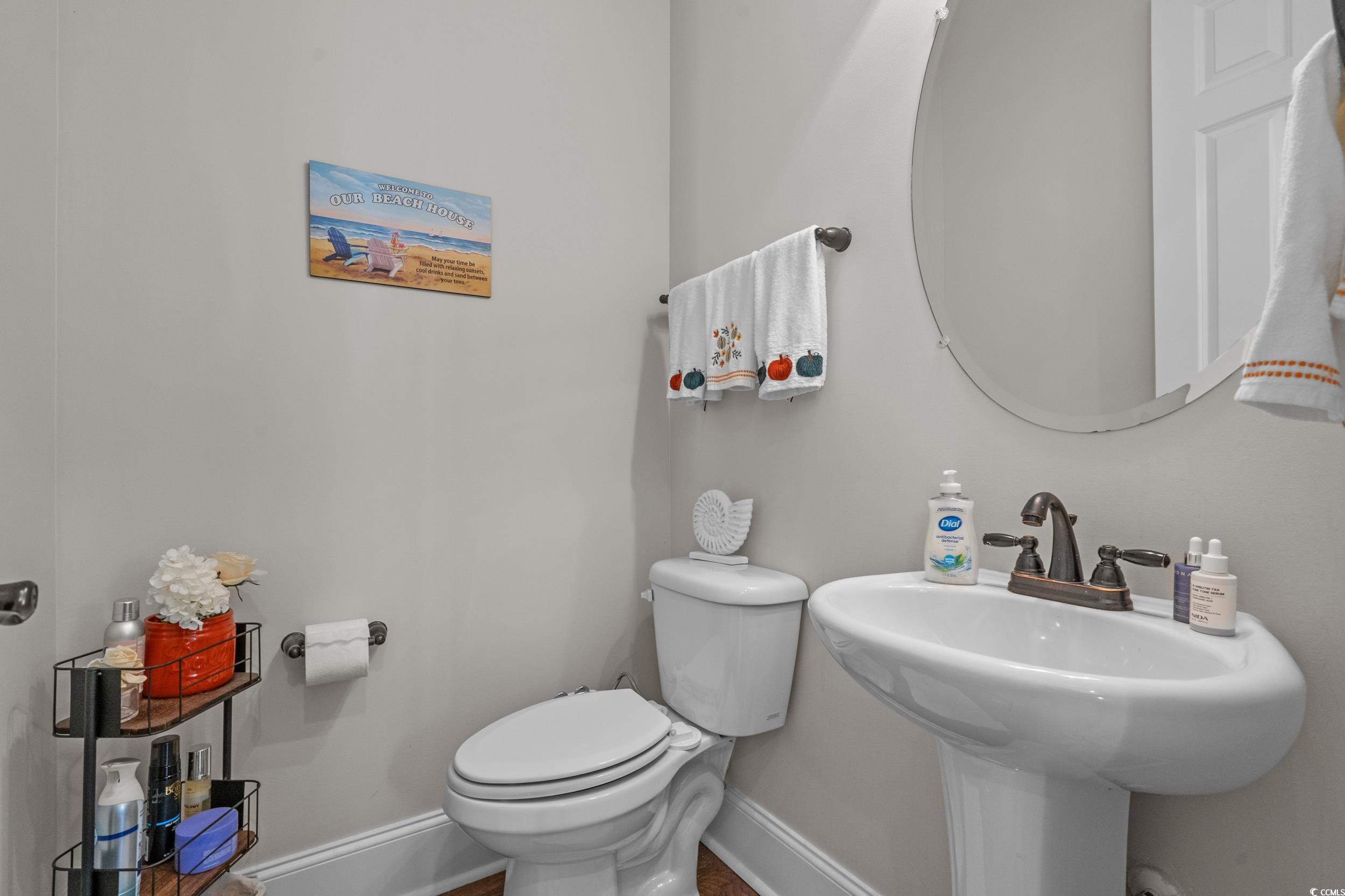 927 Iris Street Myrtle Beach, SC 29577 - Photo 33 of 40 Half bath featuring baseboards and toilet