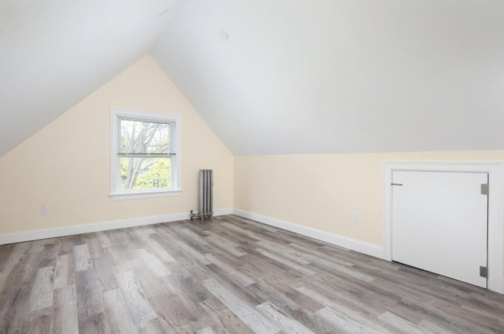 22 Winslow Road Brookline, MA 02446 - Photo 8 of 10 an empty room with wooden floor and windows