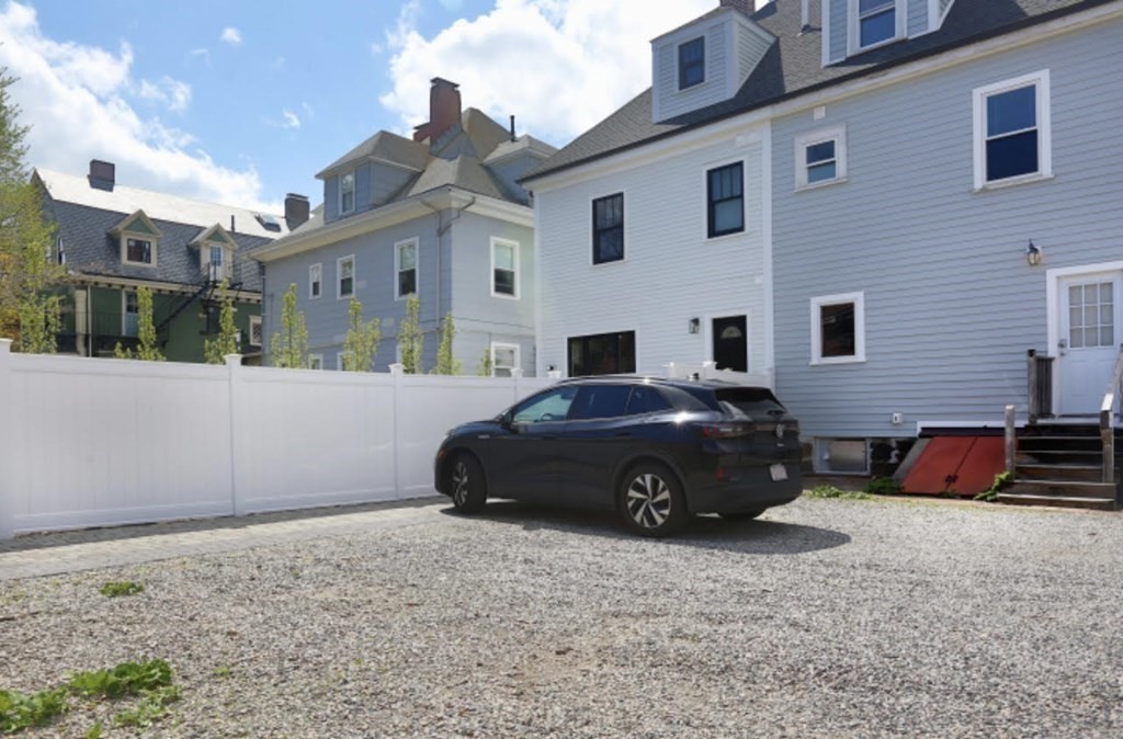 22 Winslow Road Brookline, MA 02446 - Photo 10 of 10 a car parked in front of a house