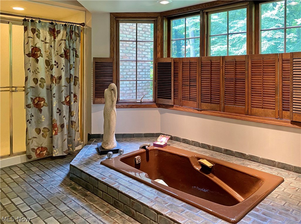 2222 Lancaster Road Akron, OH 44313 - Photo 22 of 35 Sunken tub in Master Suite with tile surround.