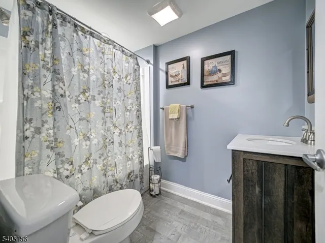 a white toilet sitting next to a bathroom sink