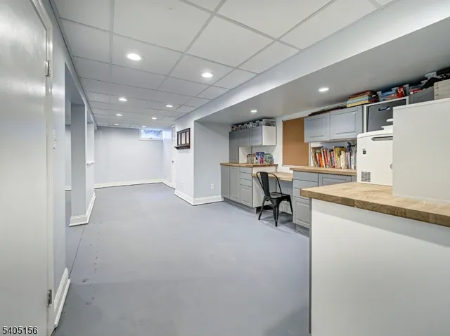 a view of kitchen with cabinets and wooden floor