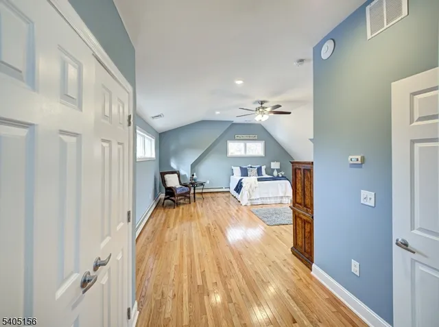 a view of living room with wooden floor
