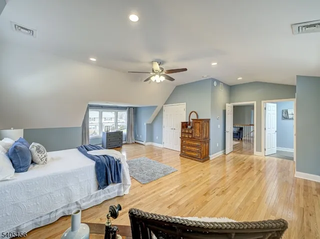 a bed room with a bed and a television