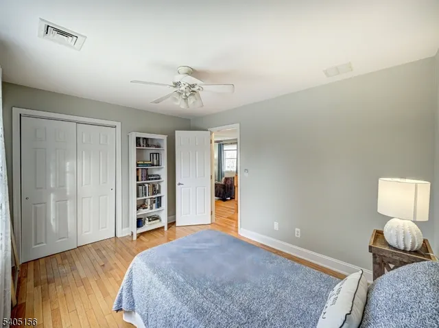 a bedroom with a bed and dresser