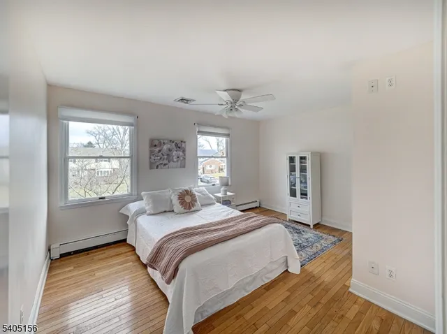 a bed room with a bed and a window