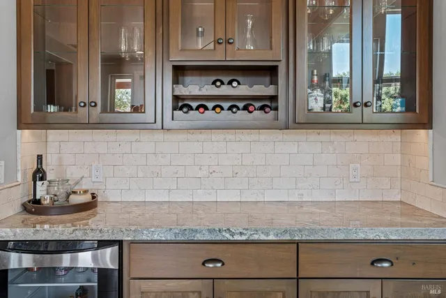 a kitchen with granite countertop stainless steel appliances and cabinets