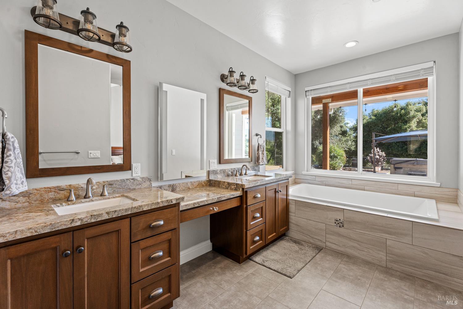 4561 Lake Ridge Road Ukiah, CA 95482 - Photo 19 of 52 a large bathroom with double vanity and a large mirror