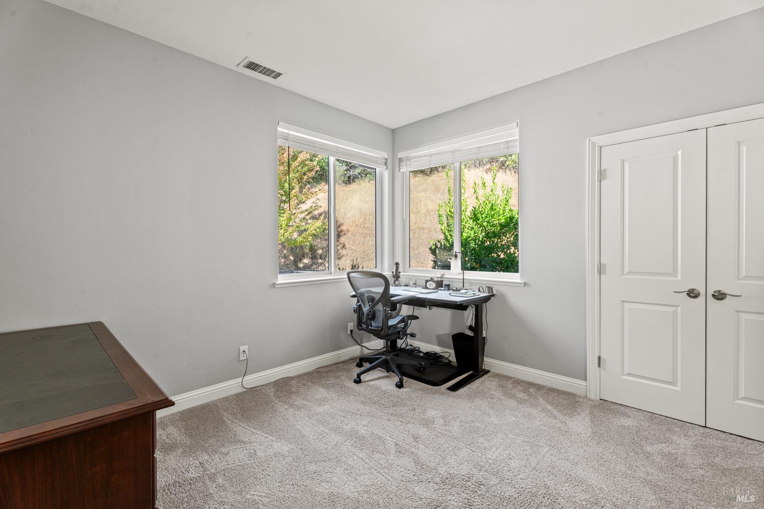 4561 Lake Ridge Road Ukiah, CA 95482 - Photo 24 of 52 a view of a workspace with furniture and a window