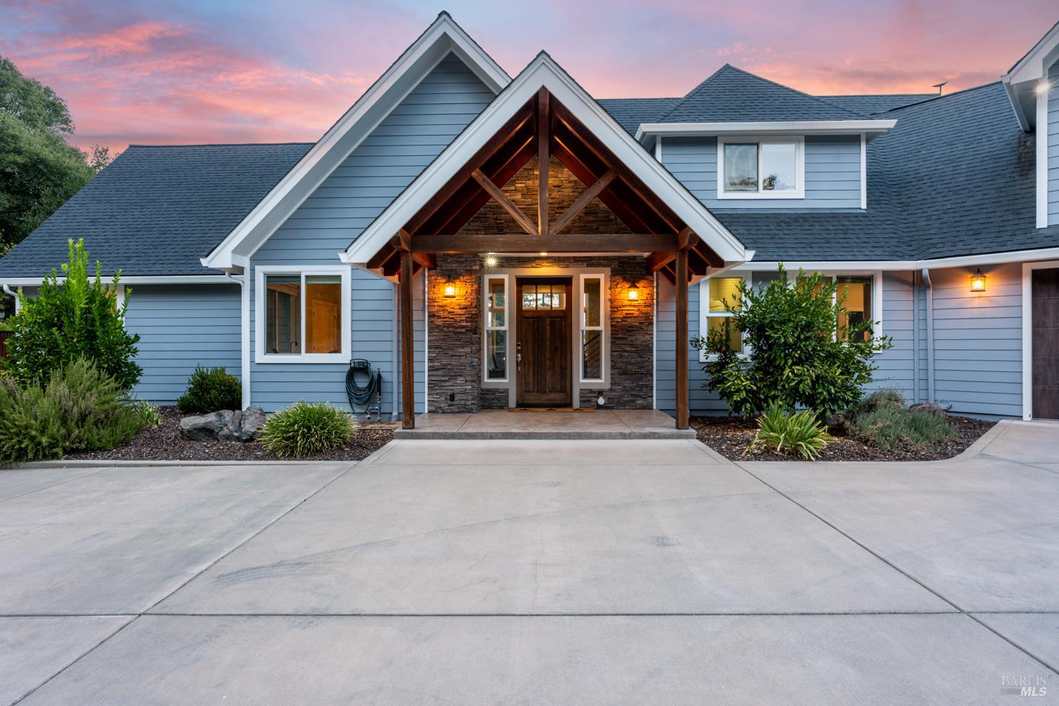 4561 Lake Ridge Road Ukiah, CA 95482 - Photo 3 of 52 a front view of a house with garden