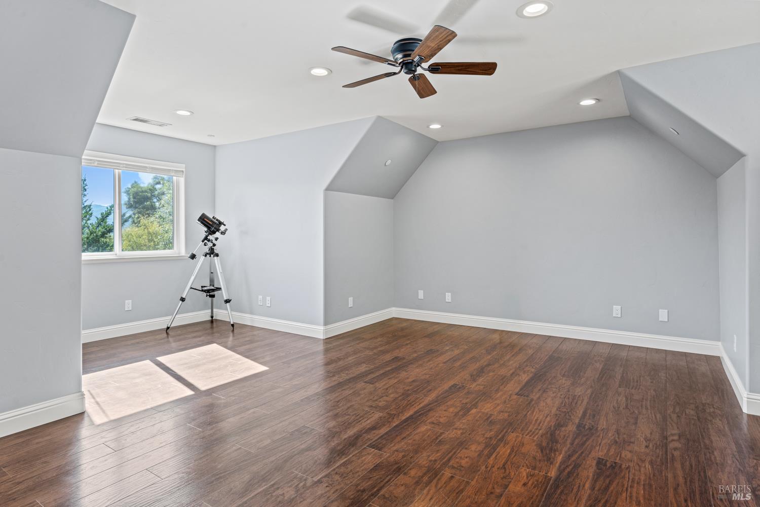 4561 Lake Ridge Road Ukiah, CA 95482 - Photo 33 of 52 a view of an empty room with wooden floor and a window
