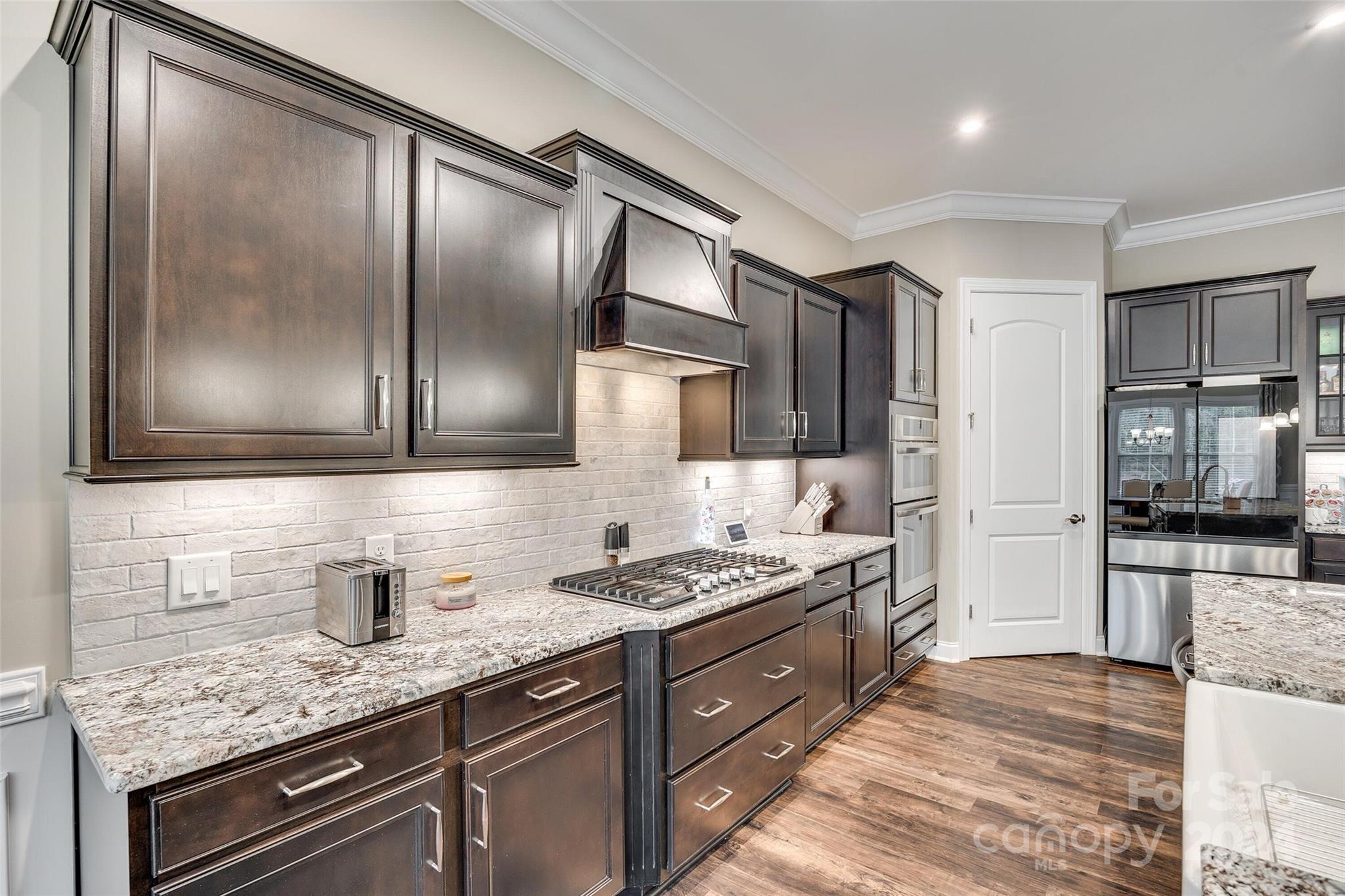 1156 Castle Road Fort Mill, SC 29707 - Photo 14 of 34 a kitchen with stainless steel appliances granite countertop a sink stove and refrigerator