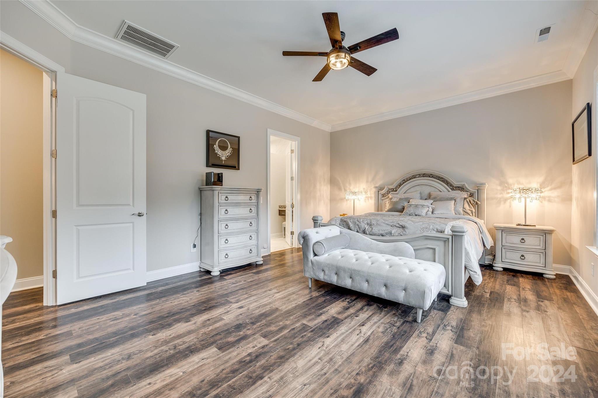 1156 Castle Road Fort Mill, SC 29707 - Photo 24 of 34 a bedroom with a bed and a chandelier