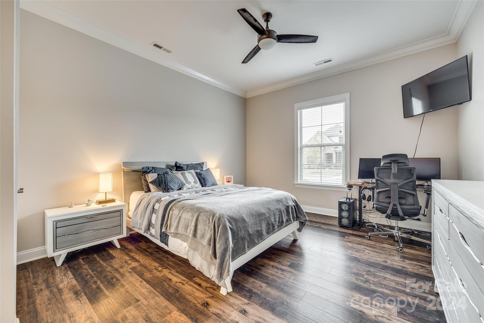 1156 Castle Road Fort Mill, SC 29707 - Photo 29 of 34 a bedroom with bed and a flat tv screen on dresser