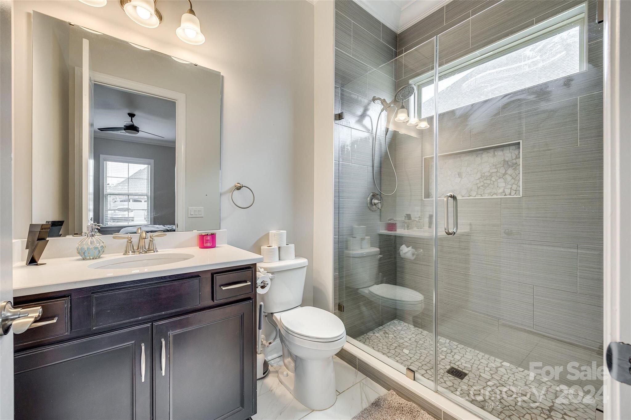 1156 Castle Road Fort Mill, SC 29707 - Photo 31 of 34 a bathroom with a sink toilet and shower