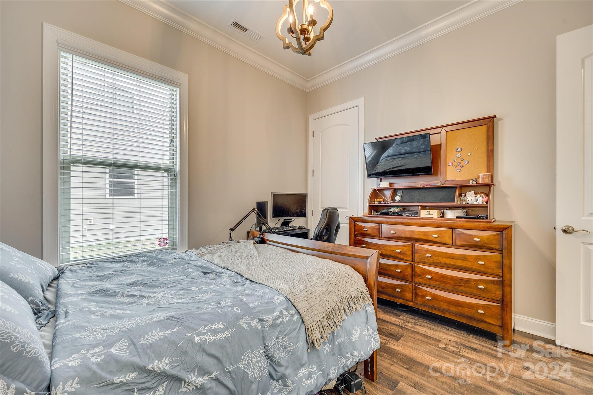1156 Castle Road Fort Mill, SC 29707 - Photo 33 of 34 a bedroom with a bed and a flat screen tv