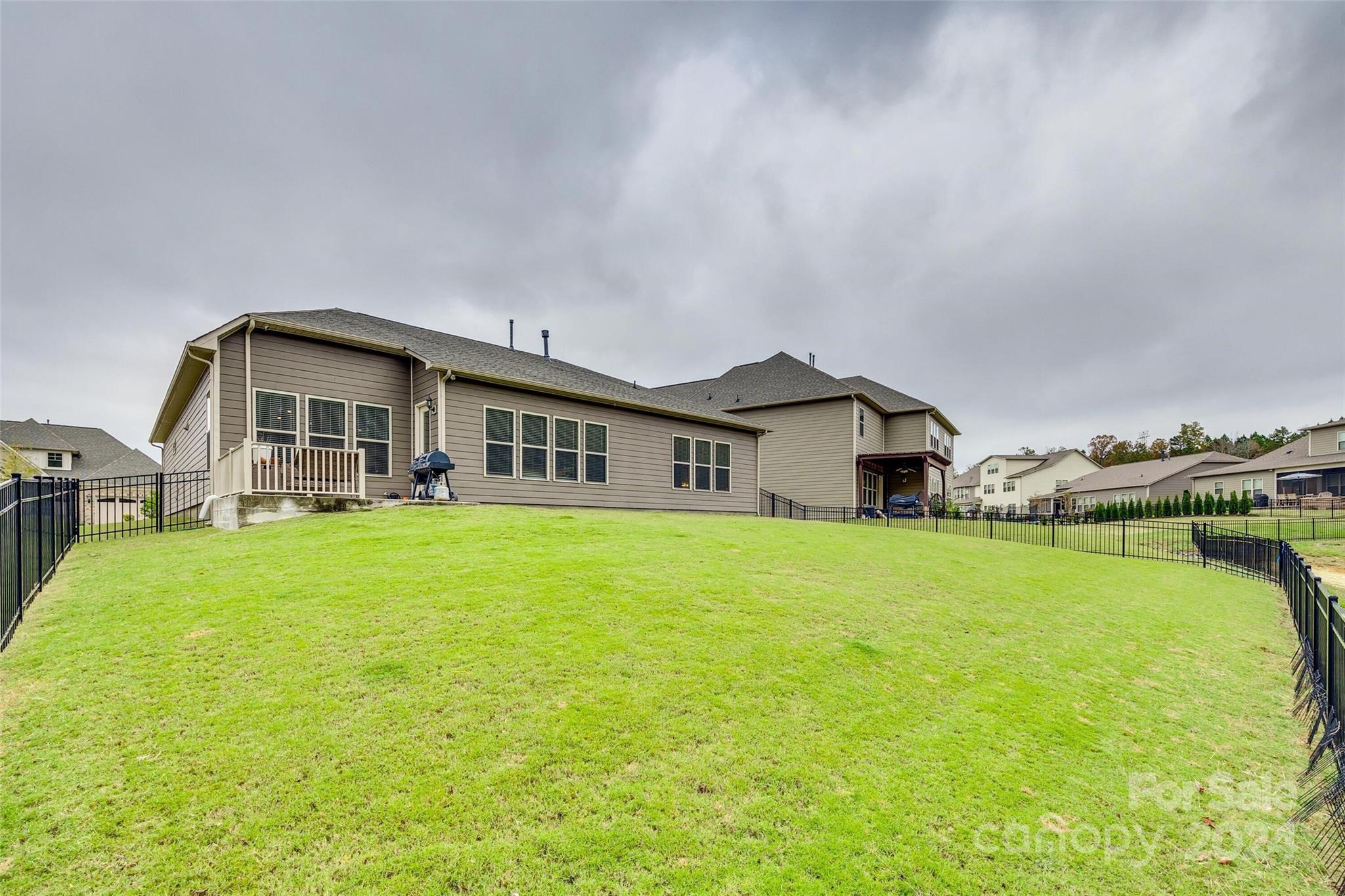 1156 Castle Road Fort Mill, SC 29707 - Photo 6 of 34 a big house with a big yard and large trees