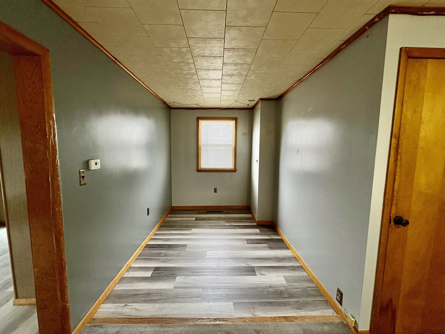 1022 1st Avenue Rochelle, IL 61068 - Photo 12 of 31 a view of a hallway with wooden floor and staircase