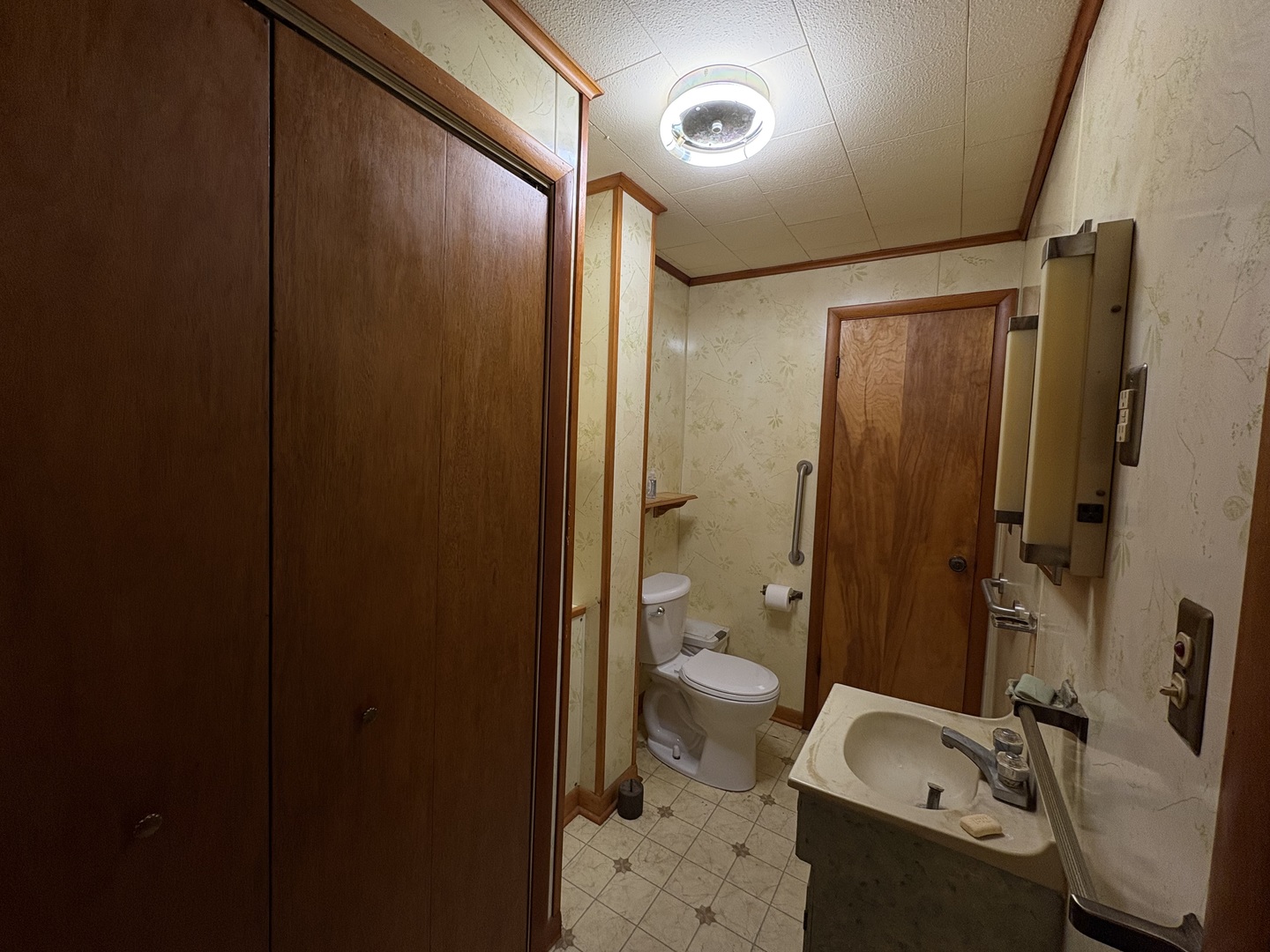 1022 1st Avenue Rochelle, IL 61068 - Photo 16 of 31 a bathroom with a granite countertop sink toilet and shower