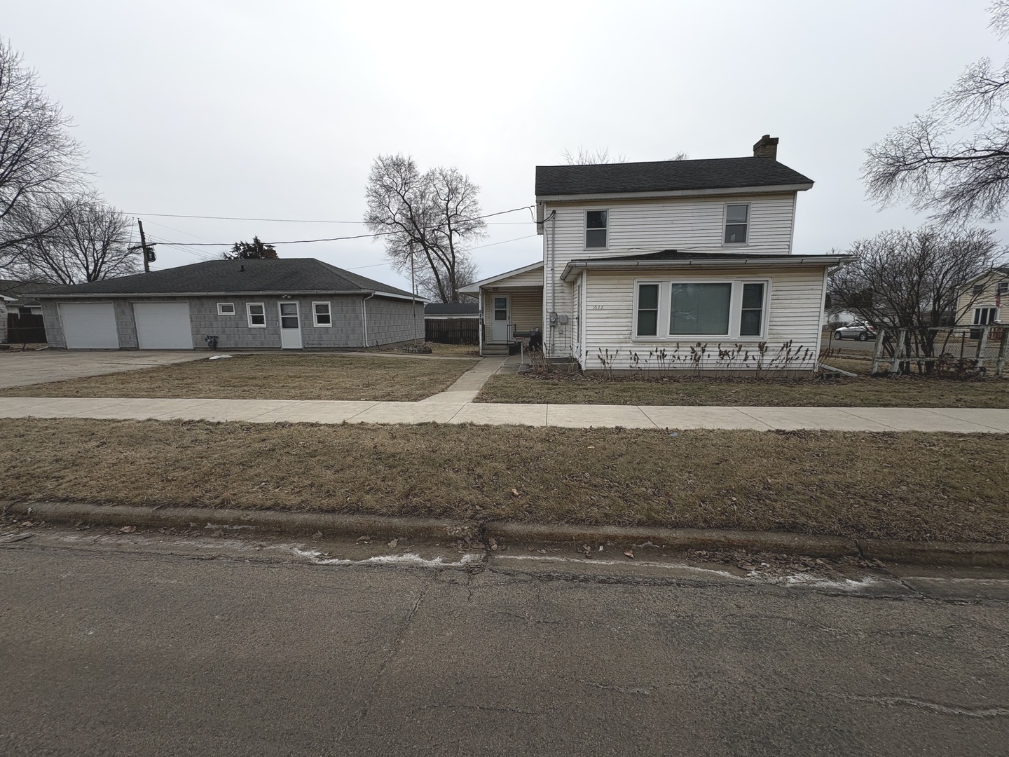 1022 1st Avenue Rochelle, IL 61068 - Photo 2 of 31 a front view of a house with a yard