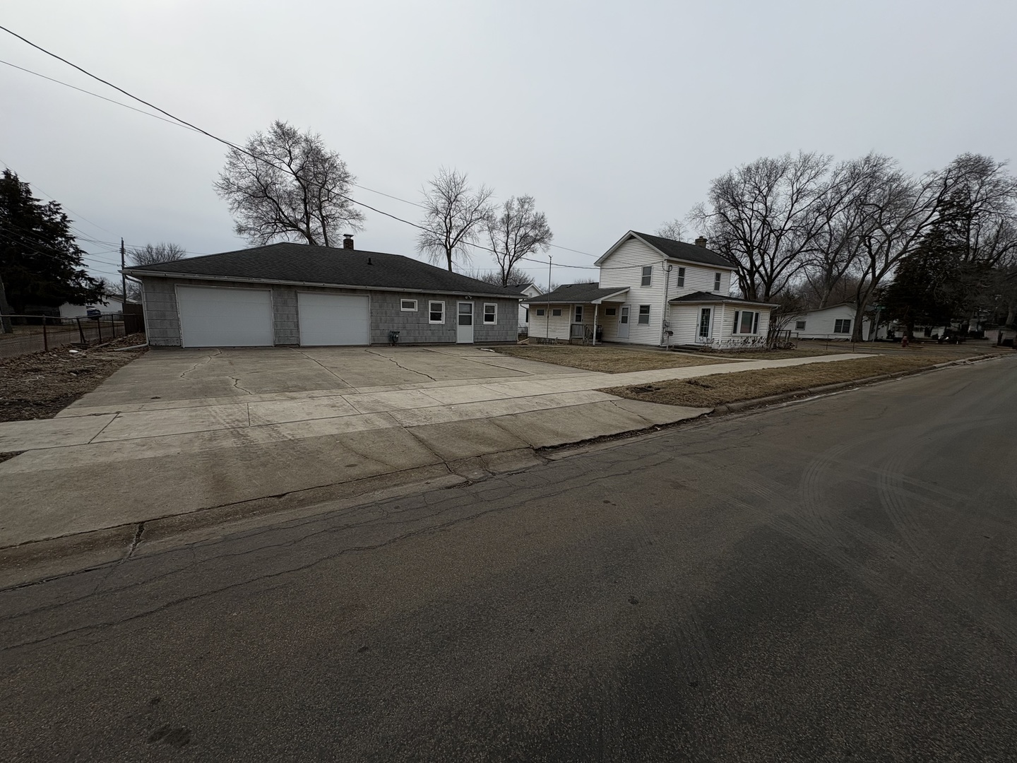 1022 1st Avenue Rochelle, IL 61068 - Photo 30 of 31 a front view of a house with a yard and garage