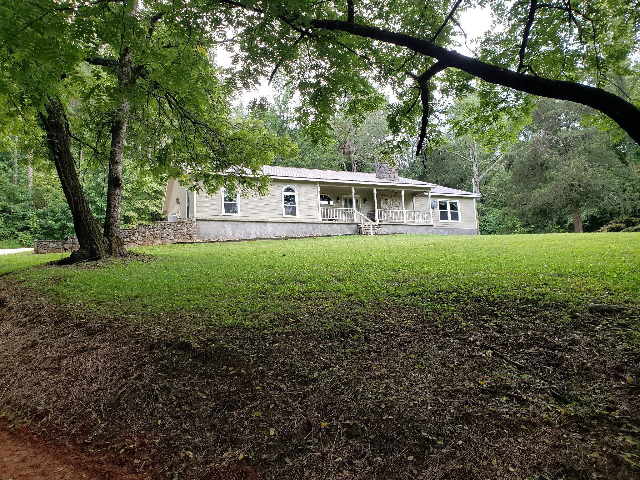 55 Short Creek Road Dellrose, TN 38453 - Photo 2 of 34 a front view of a house with yard and green space