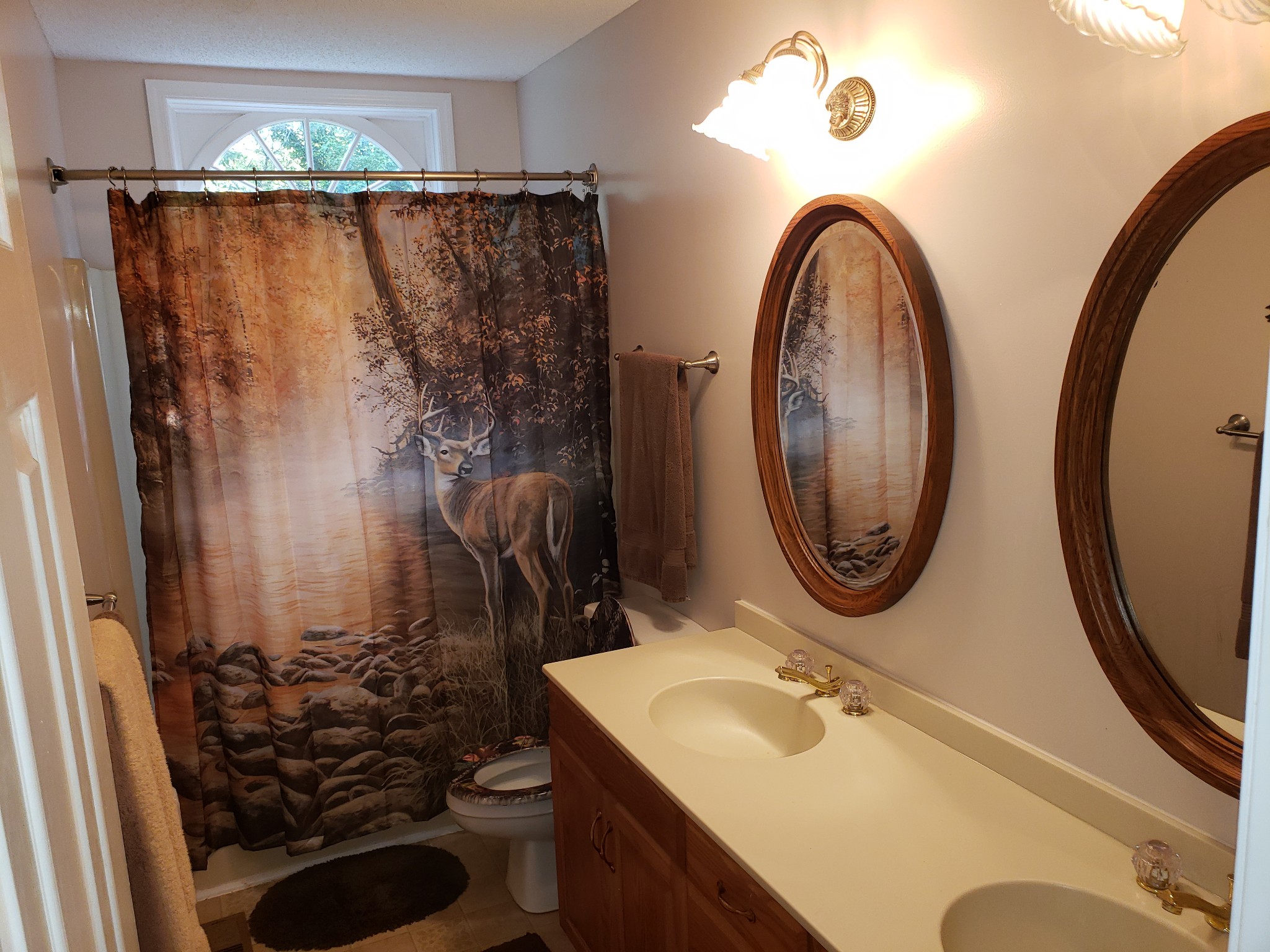55 Short Creek Road Dellrose, TN 38453 - Photo 14 of 34 a bathroom with a sink a toilet and a mirror
