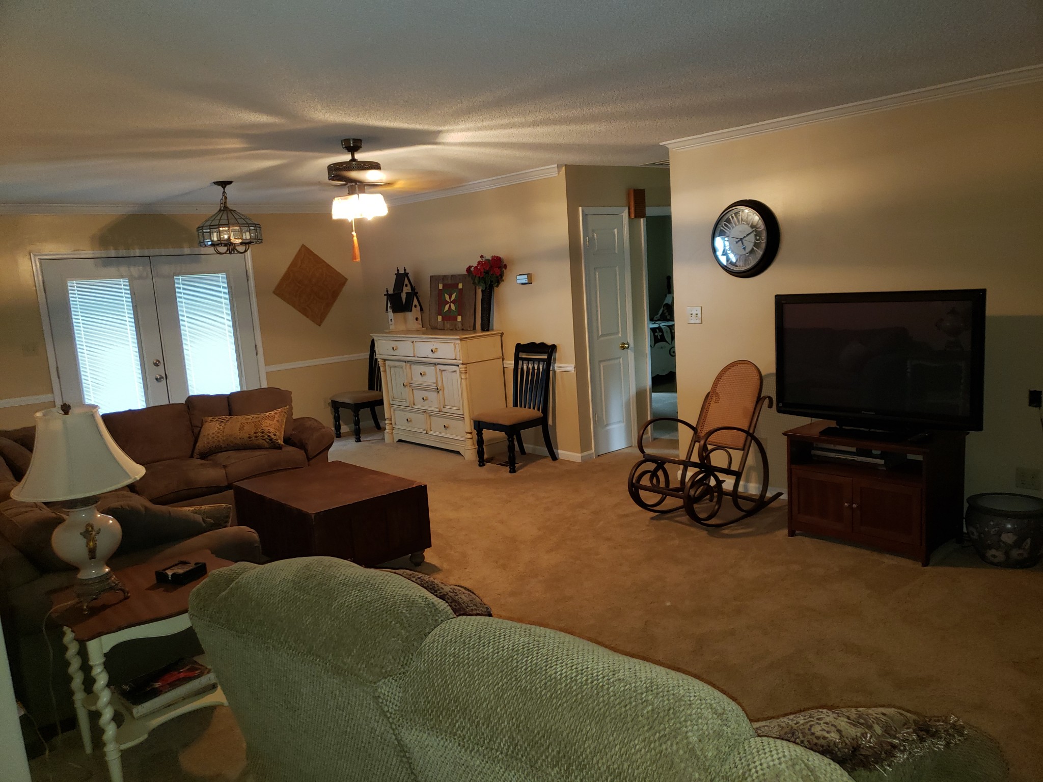 55 Short Creek Road Dellrose, TN 38453 - Photo 21 of 34 a living room with furniture a flat screen tv and gym equipment